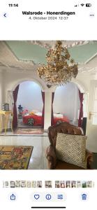 a webpage of a living room with a chandelier at Villa in Walsrode in Walsrode