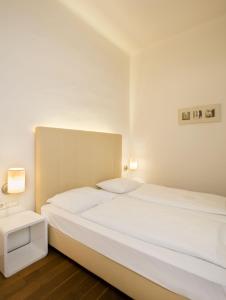 Postel nebo postele na pokoji v ubytování Apartment Nestroygasse