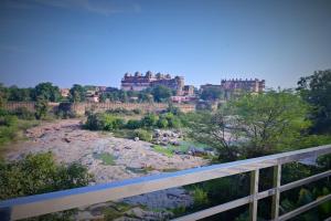 a view of a city from a bridge at hotelsiyashreeram in Orchha