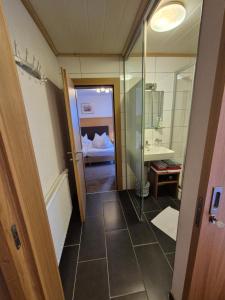 a bathroom with a walk in shower and a sink at Apart Lenz in Ischgl +103 photos
