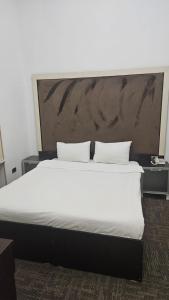 Ένα ή περισσότερα κρεβάτια σε δωμάτιο στο COSY Hotel Baku +22 φωτογραφίες