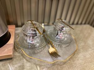 a glass plate with two silverware on a table at TH Old City Hotel in Istanbul