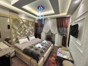 a bedroom with a large bed in a room at TH Old City Hotel in Istanbul