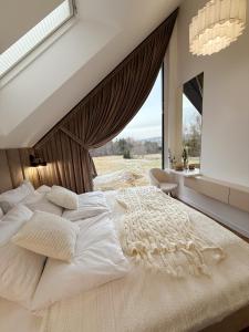 En eller flere senge i et værelse på Babiogórski Chill