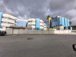 a row of buildings on the side of a street at Campus and Clinique Appart in Tunis