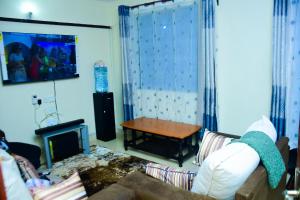 TV/trung tâm giải trí tại Ammie suites +9 ảnh