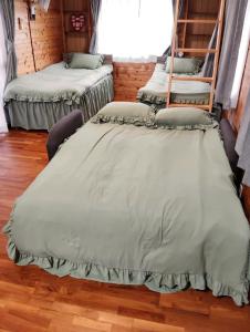 a group of beds sitting in a room at La prima stella - Vacation STAY 54161v in Nakasone