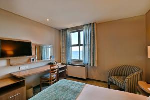 Giường trong phòng chung tại Town Lodge Gqeberha +14 ảnh