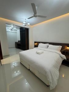 Postel nebo postele na pokoji v ubytování Qala View Inn