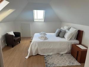 En eller flere senge i et værelse på Refugio da Ponta do Sol 2 - Madeira Inn Group