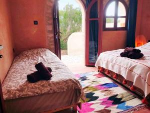 Ένα ή περισσότερα κρεβάτια σε δωμάτιο στο Zen Beach House - Sidi Kaouki