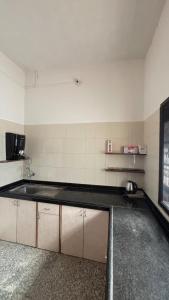 an empty kitchen with a sink in a room at Jawai Rock Resort in Jawāi Bāndh +30 photos
