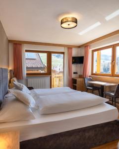 Postel nebo postele na pokoji v ubytování Garnì Lasteis B&B - apartments