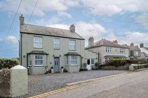 a large house on the side of a street at Heligog at Deanfield House Moelfre Sea view adult only appartment in Moelfre in Moelfre
