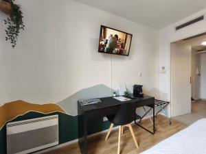 Μια τηλεόραση ή/και κέντρο ψυχαγωγίας στο Résidence calme-2 pers-parking gratuit-clim