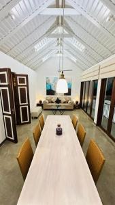 a large room with a large table and chairs at Vintage 83 Tangalle in Tangalle +28 photos