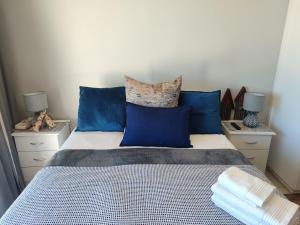 Ένα ή περισσότερα κρεβάτια σε δωμάτιο στο Onewavestay