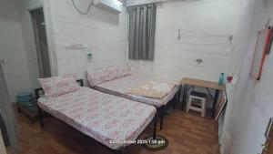 a small room with a couch and a table at Sitaram Atithi Grha in Godarpura +2 photos