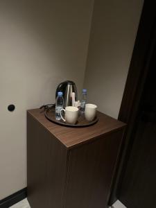 Принадлежности для чая и кофе в Jawel Crown Hotel Apartments- تاج الجوهرة للشقق الفندقية +26 фотографий