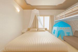 Postel nebo postele na pokoji v ubytování 富良野優中富良野