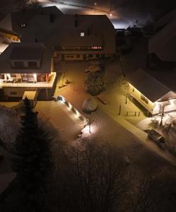an overhead view of a courtyard at night with lights at Haus Hees - Urlaub im Gletscherkessel Präg in Todtnau