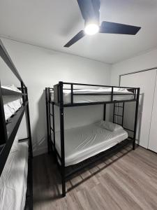 a room with two bunk beds and a ceiling fan at CG Miami House in Miami +38 photos