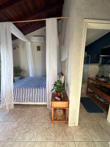 Ένα ή περισσότερα κρεβάτια σε δωμάτιο στο CASA LUZ PRAIA & PAZ