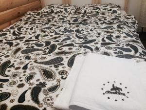 Łóżko lub łóżka w pokoju w obiekcie Agroturystyka Catranch
