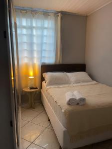 Ένα ή περισσότερα κρεβάτια σε δωμάτιο στο Casa Aconchegante em São João Del Rei