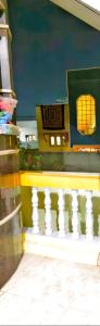 a view of a building with a white railing at Shri Laxmi Villa in Akalkot