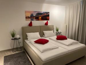 En eller flere senge i et værelse på SunSet - Moderne City Apartments in direkter Altstadt Lage & DOM