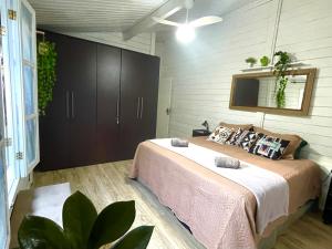 Postel nebo postele na pokoji v ubytování Oásis Completo no Centro com Piscina e Escritório + 45 fotografií