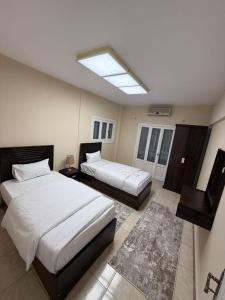 Ένα ή περισσότερα κρεβάτια σε δωμάτιο στο Kenzie Hosting