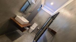 an overhead view of a bathroom with a sink and a toilet at Ametz Politak in Weligama