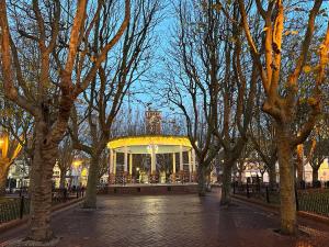 a park with a gazebo in the middle of trees at Appartement standing 500m de la plage ! in Dunkerque