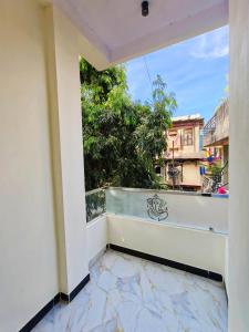 a balcony with a view of a city at Johari Heritage Home in Ujjain
