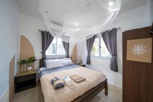 Postel nebo postele na pokoji v ubytování Tropical tiny house in fisherman s village