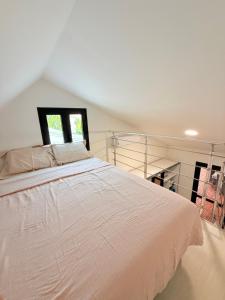 En eller flere senge i et værelse på La Kaz Lacaussade