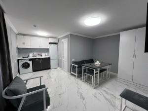 a kitchen with a table and a kitchen with a microwave at Hotel in Yerevan in Yerevan
