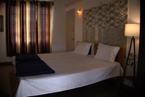 Postel nebo postele na pokoji v ubytování Anava Farms + 10 fotografií