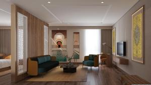 a living room with a couch and a bed and a television at Anyla Grand Hotels in Thanh Hóa