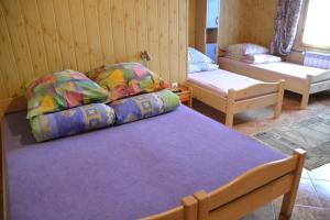 a bedroom with a bed and a couch and a chair at Biesiada in Czarna Góra