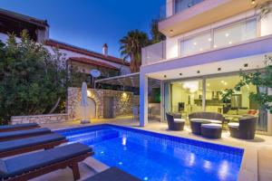 a swimming pool in the backyard of a house at Villa Gunes in Kalkan +35 photos