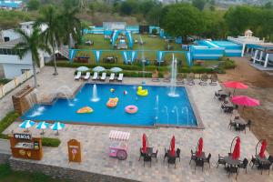 an aerial view of a pool with a water park at Takery Resort in Chittaurgarh