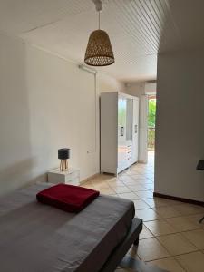 Ένα ή περισσότερα κρεβάτια σε δωμάτιο στο Le Petit Morne