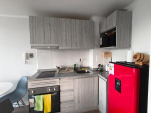 Η κουζίνα ή μικρή κουζίνα στο Oceana Suites Edifcio HA