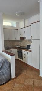 Kuchyň nebo kuchyňský kout v ubytování La Casetta