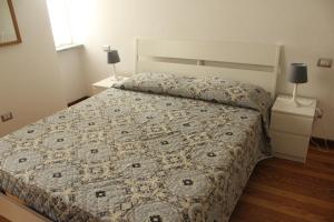 Postel nebo postele na pokoji v ubytování La Casetta