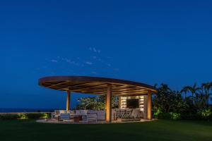 a gazebo with a table and chairs on a lawn at Casa Elije in San José del Cabo