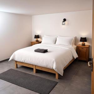 Postel nebo postele na pokoji v ubytování Le JoliCoeur